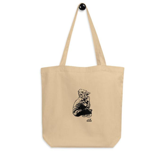 Tote bag de algodón orgánico con diseño de un niño meditando.